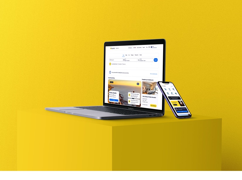 The personalised Expedia homepage shown together on a laptop and a phone.
